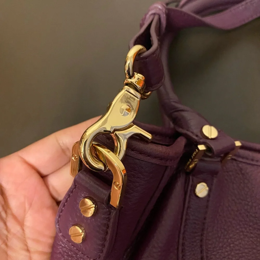 Tory Burch purple bag.